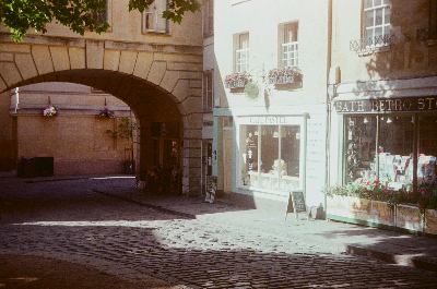 Cafe Pastel on Abbey Green, in Bath, England. Taken on 35mm film with a Kodak Retinette 1A.